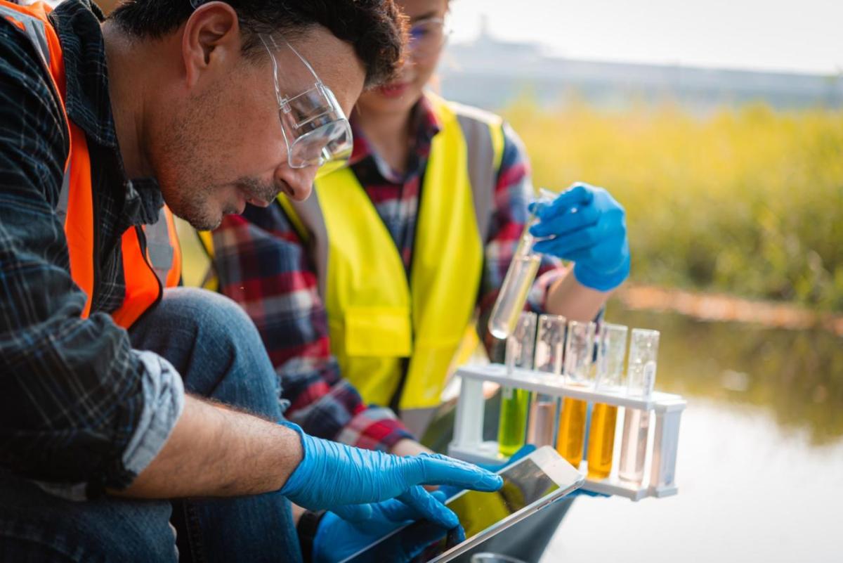 Field Workers Sampling Water